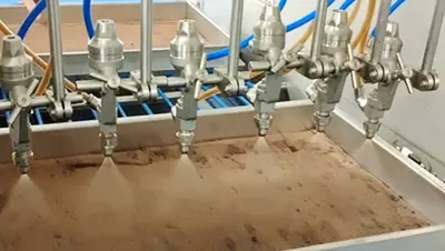 ماكينة رش السوائل ودهان بالبيض الآلية